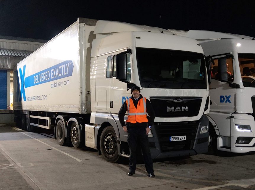 Jonathan stood in front of his lorry
